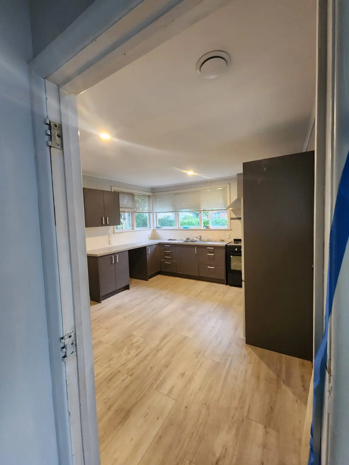 Spacious kitchen with island and modern cabinetry