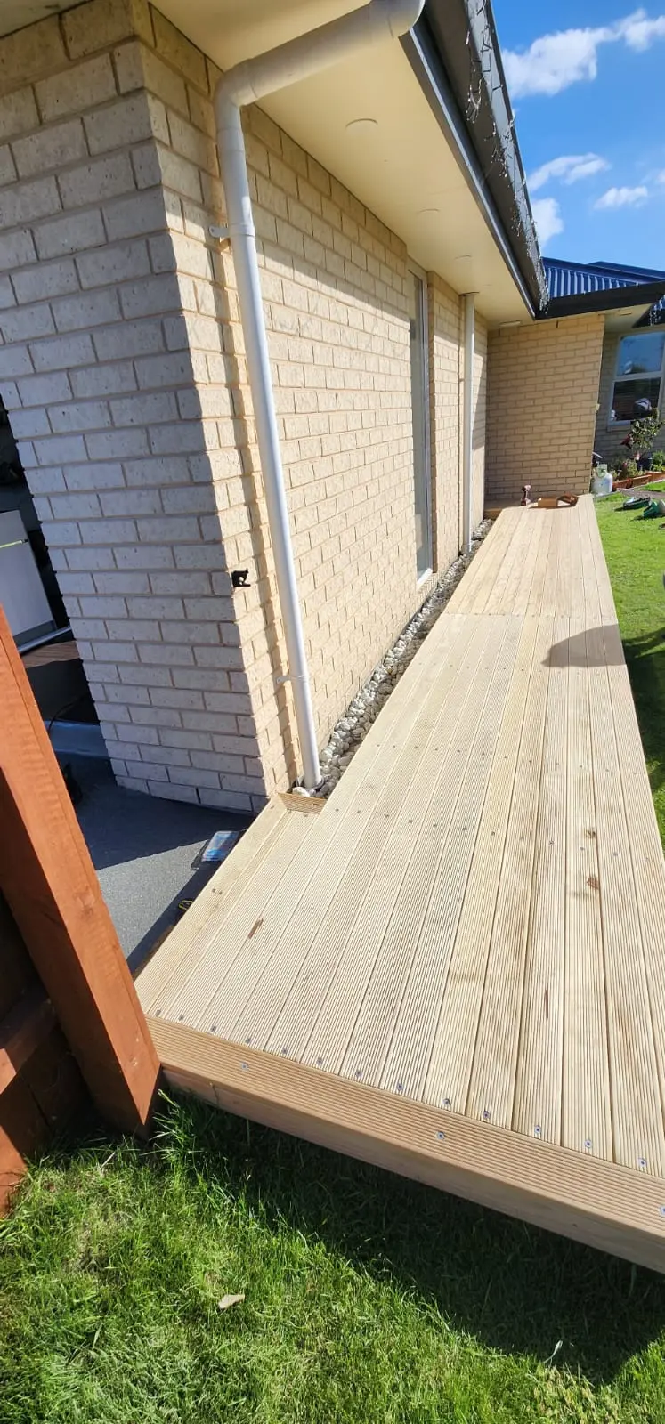 Cozy outdoor lounge area with cushions and plants